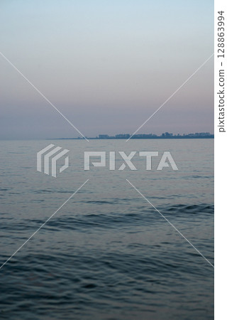 The sea, the horizon is visible. Warm weather, a breeze at sea. The sea, the horizon is visible. Warm weather, a breeze at sea. 128863994