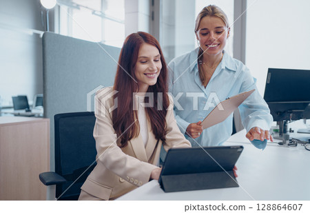 A Collaborative Business Meeting Involving Various Digital Devices for Enhanced Interactions 128864607