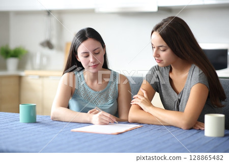 Serious interracial roommates signing contract 128865482