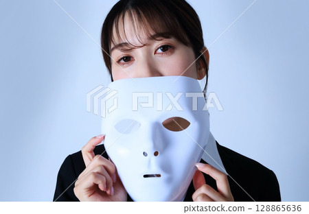 Image of a female office worker wearing a mask Image of a female office worker wearing a mask 128865636