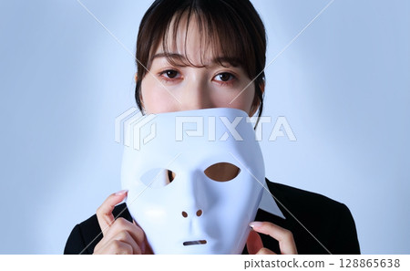 Image of a female office worker wearing a mask Image of a female office worker wearing a mask 128865638