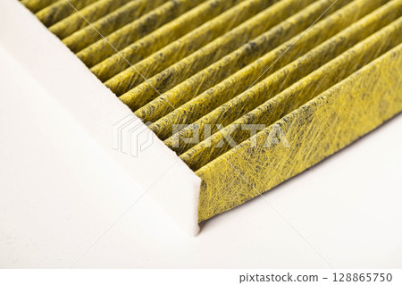 Modern car filter for cleaning the air in the car from bacteria and mold, close-up 128865750