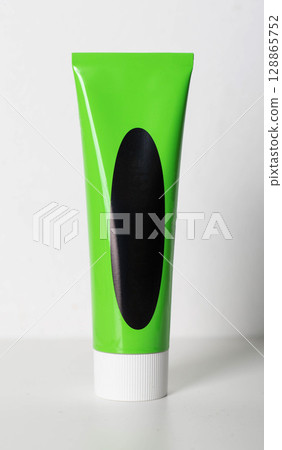 Close-up of a green tube of medicinal herbal urological paste. Close-up of a green tube of medicinal herbal urological paste. 128865752