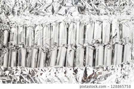 A set of medical rectal suppositories with propolis to relieve swelling and inflammation in hemorrhoids, close-up A set of medical rectal suppositories with propolis to relieve swelling and inflammation in hemorrhoids, close-up 128865758