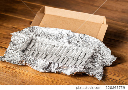 A set of medical rectal suppositories with propolis to relieve swelling and inflammation in hemorrhoids, close-up A set of medical rectal suppositories with propolis to relieve swelling and inflammation in hemorrhoids, close-up 128865759