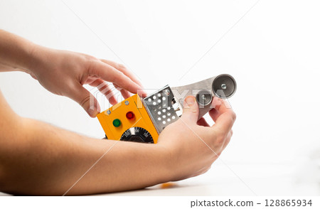 Replacing nozzles on a plumbing electric soldering iron on a white background, isolate, close-up 128865934