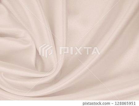 Smooth elegant golden silk or satin luxury cloth texture as wedding background. Luxurious background design. In Sepia toned. Retro style Smooth elegant golden silk or satin luxury cloth texture as wedding background. Luxurious background design. In Sepia toned. Retro style 128865951