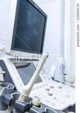Advanced Medical Imaging Equipment in a Clinical Setting with an Ultrasound Machine Displaying Diagnostic Images on a Screen for Patient Assessments and Examinations Advanced Medical Imaging Equipment in a Clinical Setting with an Ultrasound Machine Displaying Diagnostic Images on a Screen for Patient Assessments and Examinations 128866139