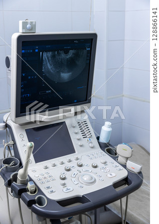 Advanced Ultrasound Machine with Control Panel and Monitor Displaying Diagnostic Image in Medical Examination Room Advanced Ultrasound Machine with Control Panel and Monitor Displaying Diagnostic Image in Medical Examination Room 128866141