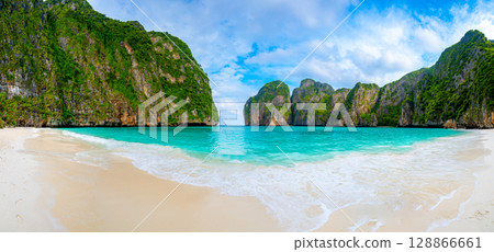 View of famous Maya Bay, Thailand. One of the most popular beach in the world. Ko Phi Phi islands. Beach without people. View of famous Maya Bay, Thailand. One of the most popular beach in the world. Ko Phi Phi islands. Beach without people. 128866661