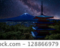Chureito Pagoda under a star-filled night sky with the majestic silhouette of Mount Fuji in the background, Arakurayama Sengen Park, Japan 128866979