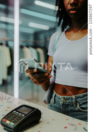 woman paying with phone at store, generative AI 128867297