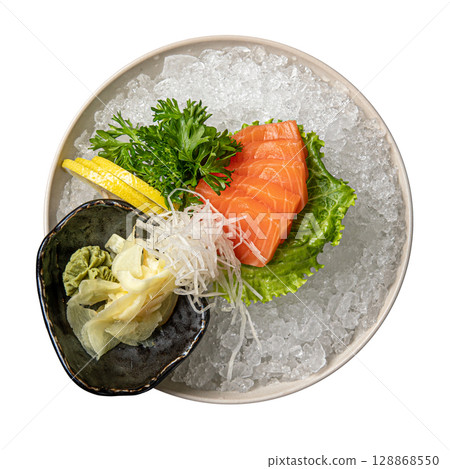 Salmon sashimi on ice with lemon and wasabi 128868550