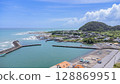 Drone aerial view of the coast and townscape of Kamogawa City, Chiba Prefecture 128869951