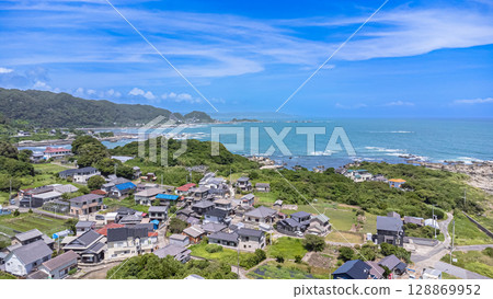 Drone aerial view of the coast and townscape of Kamogawa City, Chiba Prefecture 128869952