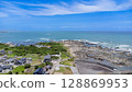 Drone aerial view of the coast and townscape of Kamogawa City, Chiba Prefecture 128869953