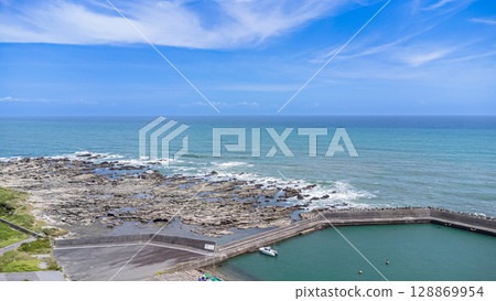 Drone aerial view of the coast and townscape of Kamogawa City, Chiba Prefecture 128869954