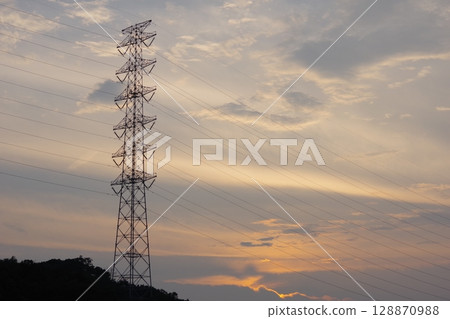 Power lines dyed in the sunset Power lines dyed in the sunset 128870988