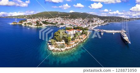 Greece travel destination scenic places - Skiathos island, Sporades., aerial drone panoramic view of old town Greece travel destination scenic places - Skiathos island, Sporades., aerial drone panoramic view of old town 128871050