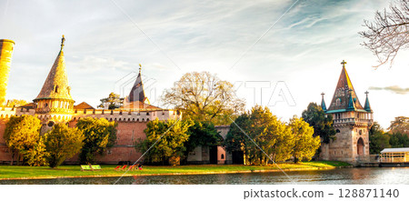 Panoramic view on autumn Laxenburg park with medieval Franzensburg castle on lake, Lower Austria 128871140