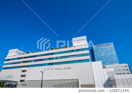 Yokohama cityscape in Japan, overlooking the east exit of Yokohama Station (center) and JR Yokohama Tower (back right). Yokohama cityscape in Japan, overlooking the east exit of Yokohama Station (center) and JR Yokohama Tower (back right). 128871244