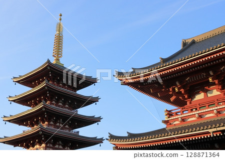 The five-story pagoda of Sensoji Temple shining in the evening sun The five-story pagoda of Sensoji Temple shining in the evening sun 128871364