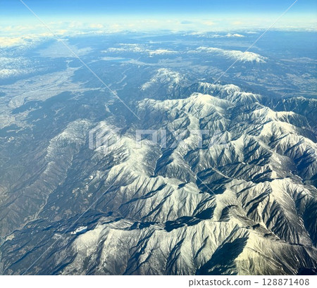 Aerial shots of mountain ranges: majestic mountain ranges with beautiful ridgelines 128871408