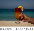 alcohol cocktail on the beach 128871933