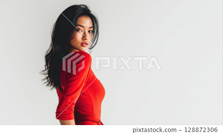 Fashion portraits of Asian women in bright red outfits posing against white backgrounds 128872306