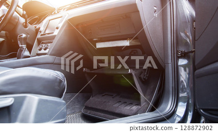 Replacing an old dirty cabin filter with a new one. Car maintenance, close-up 128872902