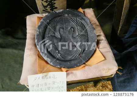 A roof tile bearing the double crane crest of the Morioka Domain in Morioka City, Iwate Prefecture A roof tile bearing the double crane crest of the Morioka Domain in Morioka City, Iwate Prefecture 128873176