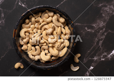 Raw Cashews In Rustic Bowl, Nutritious Snack For Health Lovers Raw Cashews In Rustic Bowl, Nutritious Snack For Health Lovers 128873347