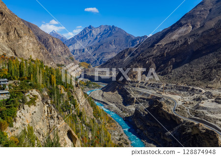 Autumn view blue water of Hunza River with mountain range in the background,Hunza, Pakistan. Autumn view blue water of Hunza River with mountain range in the background,Hunza, Pakistan. 128874948