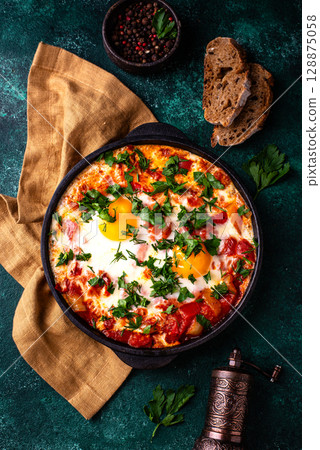 Shakshuka, traditional Jewish breakfast dish 128875058
