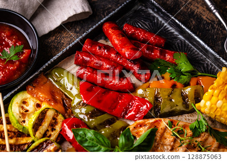Assortment of grilled bbq meat and vegetables Assortment of grilled bbq meat and vegetables 128875063