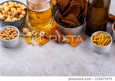 Beer and different snacks for Superbowl or football party Beer and different snacks for Superbowl or football party 128875075