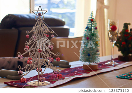 Christmas tree on the table Christmas tree on the table 128875120