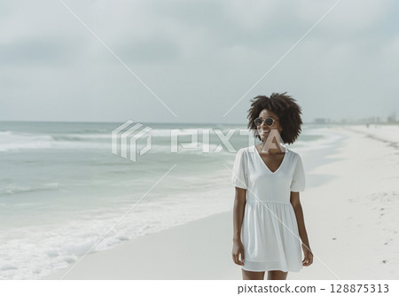 Happy Black woman in a white dress walking on a peaceful beach. AI generated. 128875313