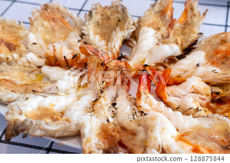Grilled river prawns served on plate Grilled river prawns served on plate 128875844