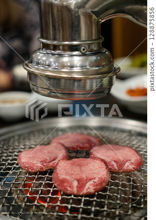 Korean Style Barbecue Grill BBQ. Hanwoo rare beef tongue meat on the grill with soft focus Korean Style Barbecue Grill BBQ. Hanwoo rare beef tongue meat on the grill with soft focus 128875856