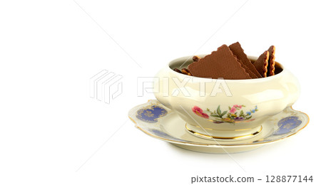 Cookies in vintage porcelain plate isolated on white background. Cookies in vintage porcelain plate isolated on white background. 128877144