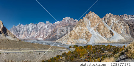 The autumn scenery with Tupopdan, Passu Cathedral or Passu Cones, is a mountain in northern Pakistan The autumn scenery with Tupopdan, Passu Cathedral or Passu Cones, is a mountain in northern Pakistan 128877171