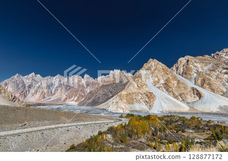 The autumn scenery with Tupopdan, Passu Cathedral or Passu Cones, is a mountain in northern Pakistan The autumn scenery with Tupopdan, Passu Cathedral or Passu Cones, is a mountain in northern Pakistan 128877172