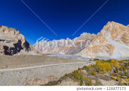 The autumn scenery with Tupopdan, Passu Cathedral or Passu Cones, is a mountain in northern Pakistan 128877173