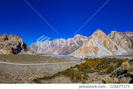 The autumn scenery with Tupopdan, Passu Cathedral or Passu Cones, is a mountain in northern Pakistan 128877175