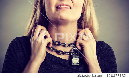 Woman having chain around neck Woman having chain around neck 128877182