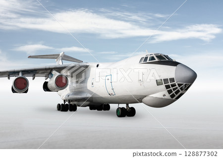 White wide body transport freight airplane isolated on bright background with sky White wide body transport freight airplane isolated on bright background with sky 128877302