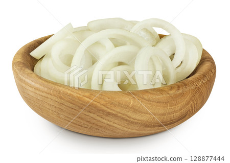 Onion slices in a wooden bowl isolated on a white background. Onion slices in a wooden bowl isolated on a white background. 128877444