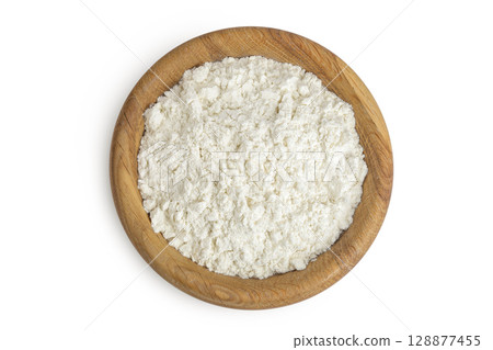 White flour in wooden bowl isolated on white background. Top view. Flat lay. White flour in wooden bowl isolated on white background. Top view. Flat lay. 128877455