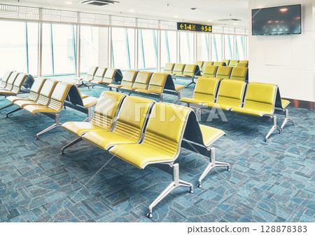 Empty airport terminal, color toning applied Empty airport terminal, color toning applied 128878383